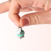 Ciondolo in Metallo campanella portafortuna Capri con cristalli bianchi e smalto verde marino