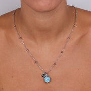 Collana in Metallo con campanella portafortuna pendente impreziosita da smalto turchese e cristalli