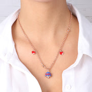 Collana in Metallo con campana blu e fiocco filo rosso e due cuori pendenti rossi