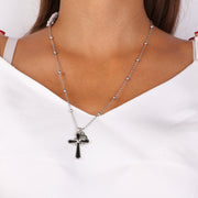 Collana in Metallo con pendente a forma di croce con infinito