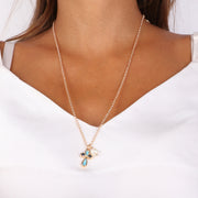 Collana in Metallo con pendente a forma di croce smaltato blu e nero con dettaglio in perla