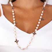 Collana in Metallo con perle bianche impreziosite da croci con cristalli neri