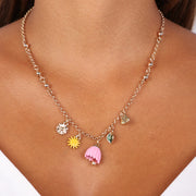 Collana in Metallo con campanella a forma di fiore rosa, sole e cuore con capri