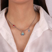 Collana in Metallo con campanella e fiocco centrale con pendenti a forma di bimbo e cuore