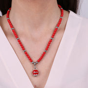 Collana in Metallo con campanellina pendente e perline rosse
