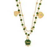 Multi-strand metal necklace with bell and green stones