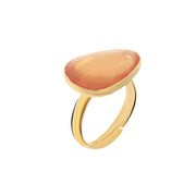 Metal ring with orange stone