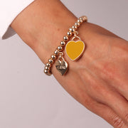 Bracciale in Metallo con cuore pendente in smalto giallo e scritta Capri