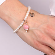 Bracciale in Metallo Bracciale in Metallo con perle e campanella portafortuna in smalto rosa