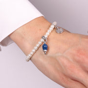 Bracciale in Metallo Bracciale in Metallo con perle e campanella portafortuna in smalto blu