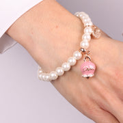 Bracciale in Metallo Bracciale in Metallo con perle e campanella portafortuna in smalto rosa con scritta Capri