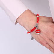 Bracciale in Metallo con campanella pendente e perline rossi