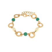 Metal bracelet with green stones and pearls
