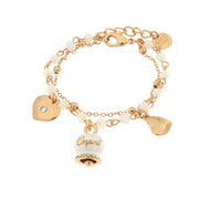 Multi-strand metal bracelet with white stones and white Capri bell