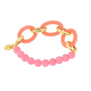 Metal bracelet with pink stones and orange chains
