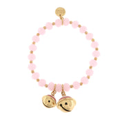 Metal bracelet with rattles and pink stones
