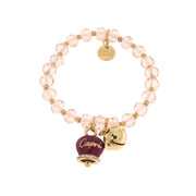 Metal bracelet with purple bell and small rattle with pink stones