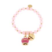 Metal bracelet with fuchsia bell and small rattle with pink stones