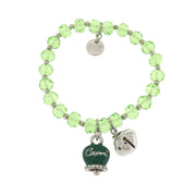 Metal bracelet with green bell and small rattle with green stones