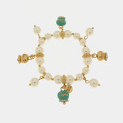 Bracciale in Metallo Bracciale in Metallo con perle e campanelle portafortuna in smalto verde con scritta Capri