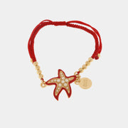 Bracciale in Metallo con cordino rosso e sfere con stella marina